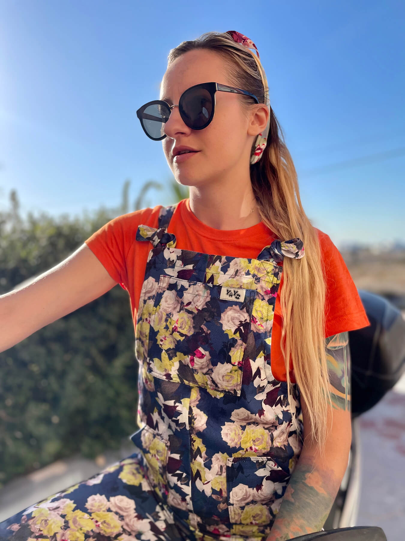 woman wearing YAYS cotton overalls in Daisy Dot, close-up front view