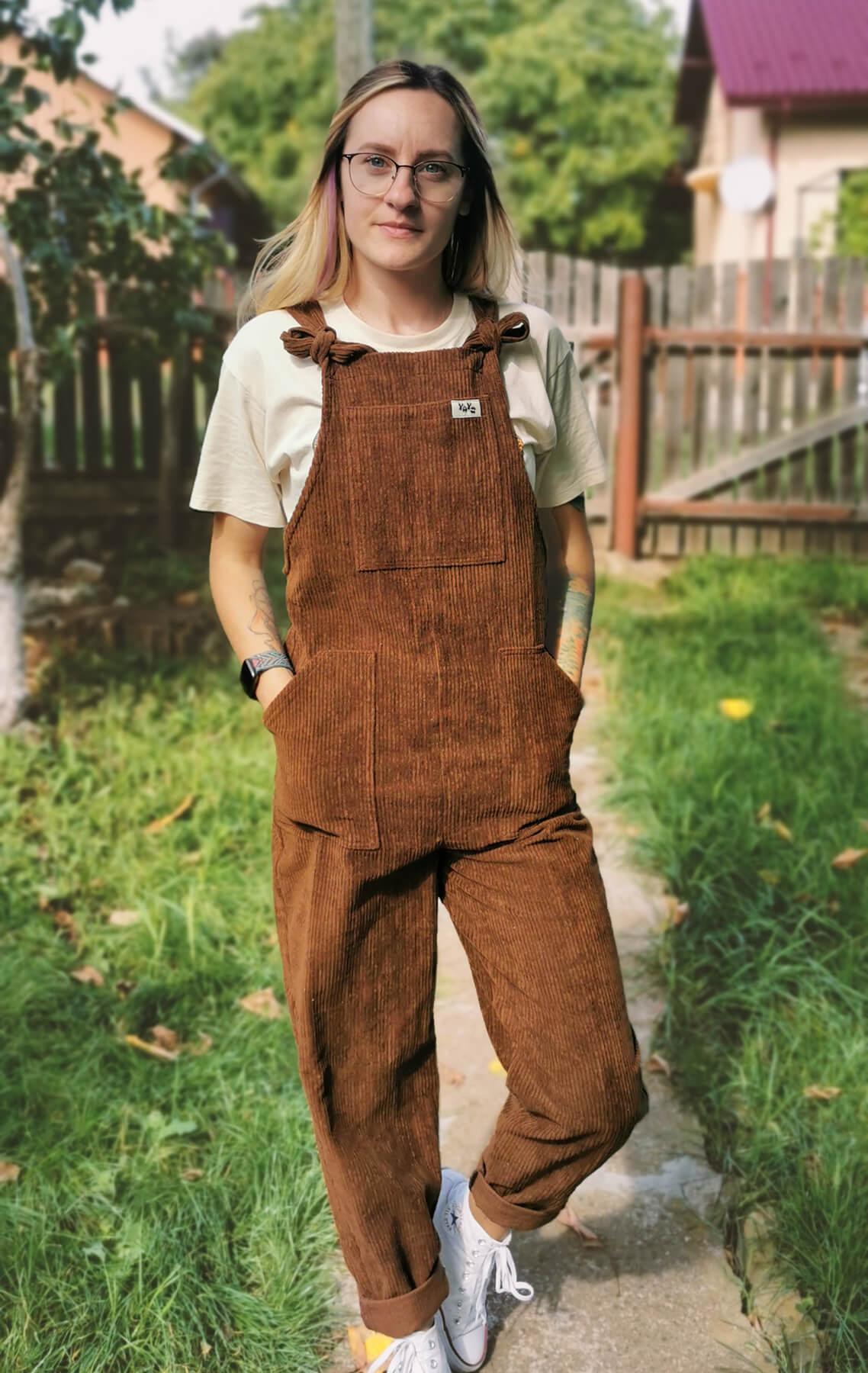 Female model wearing YAYS dungaree in Bark Brown, front view