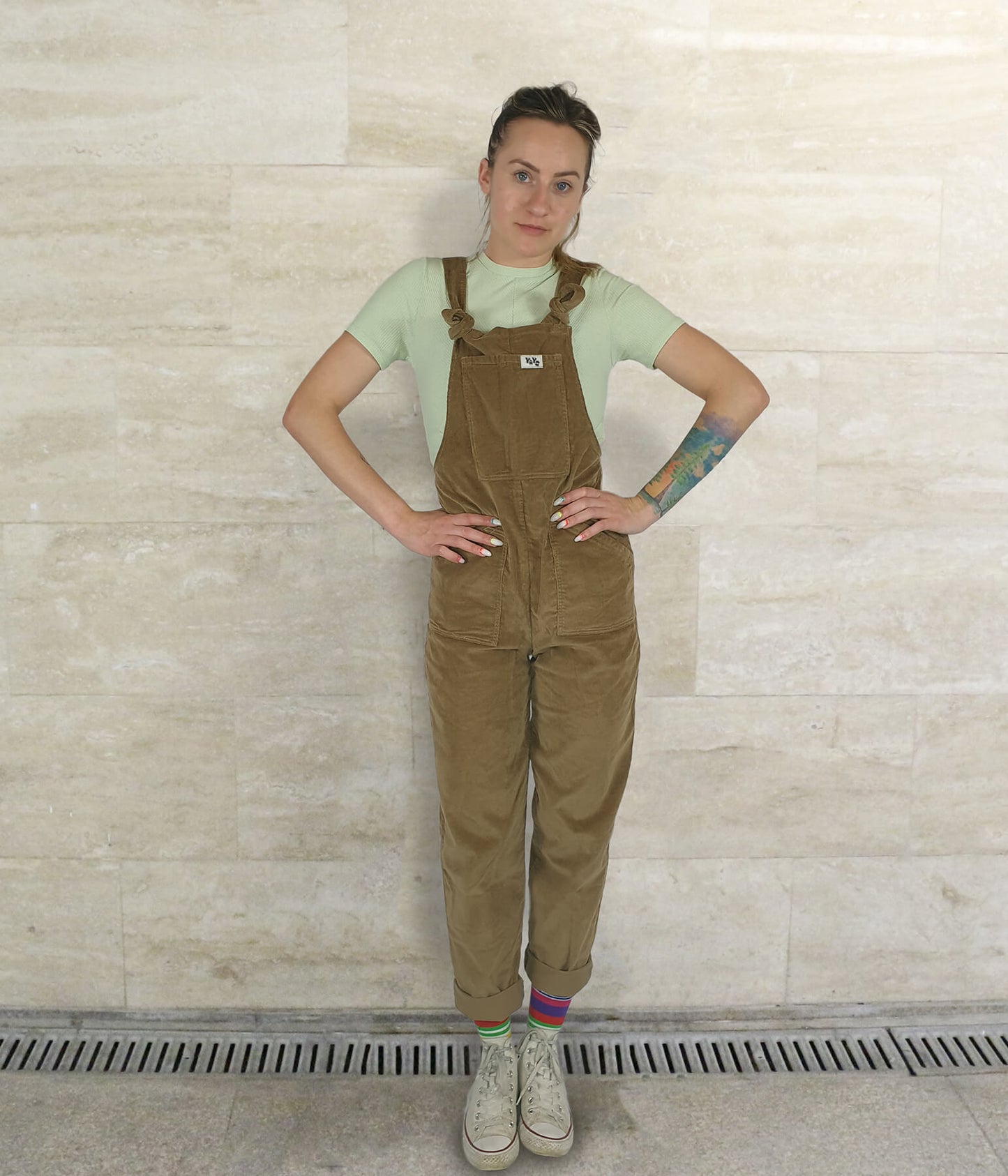 female model wearing YAYS unisex overalls in Cherry Wood, front view