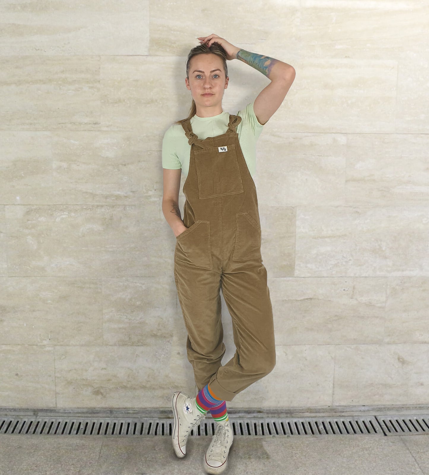 female model posing in YAYS unisex dungarees in Cherry Wood, front view