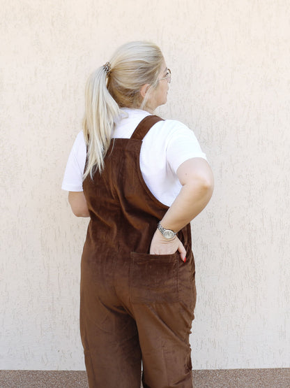 female model in YAYS corduroy overalls, back view, back pocket detail showing