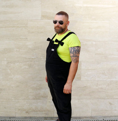 Male model, posing wearing YAYS dungarees in Pine Green, left side view