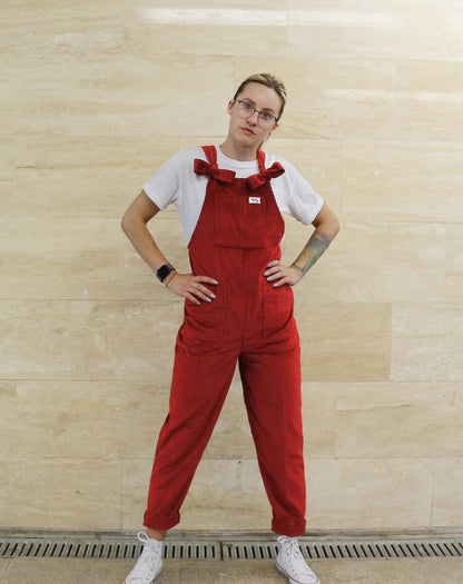 female posing in YAYS corduroy dungarees in Scarlet Red, front view