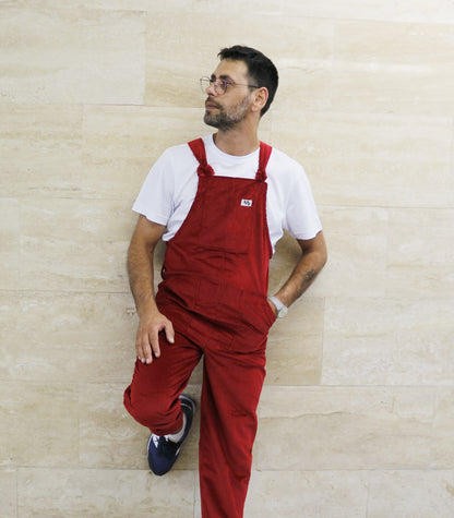 male model posing in YAYS overalls in Scarlet Red, front view