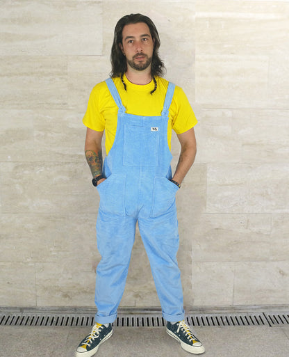 Male model posing in Yays corduroy cotton dungarees in Serenity Blue, front view