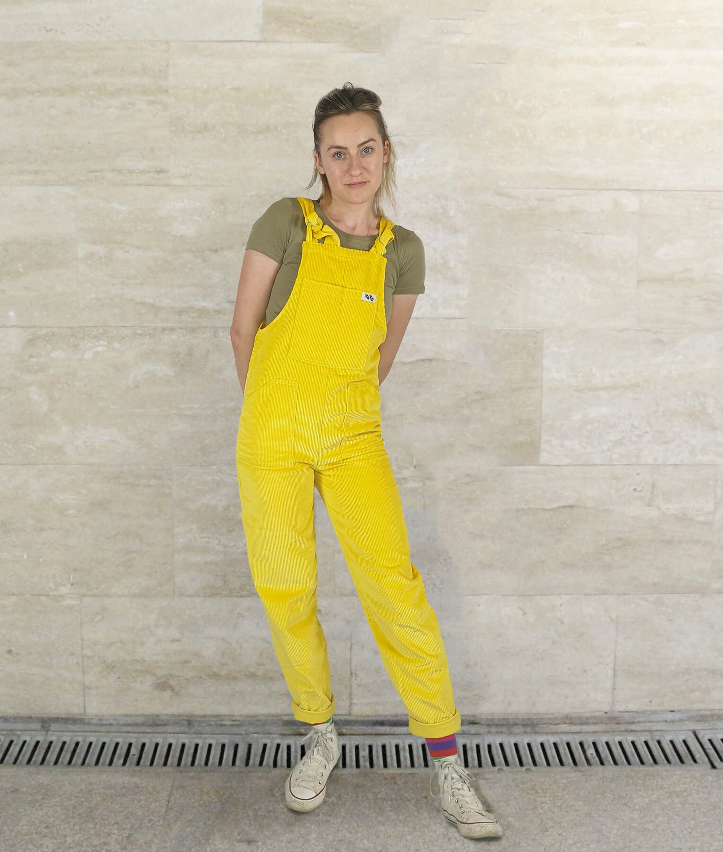 woman posing in YAYS unisex overalls in SUnshine Yellow, front view