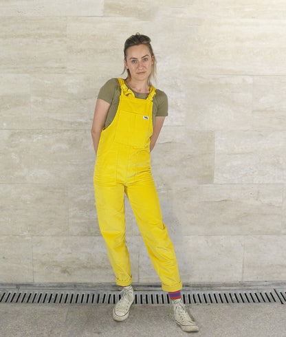 woman posing in YAYS unisex overalls in SUnshine Yellow, front view