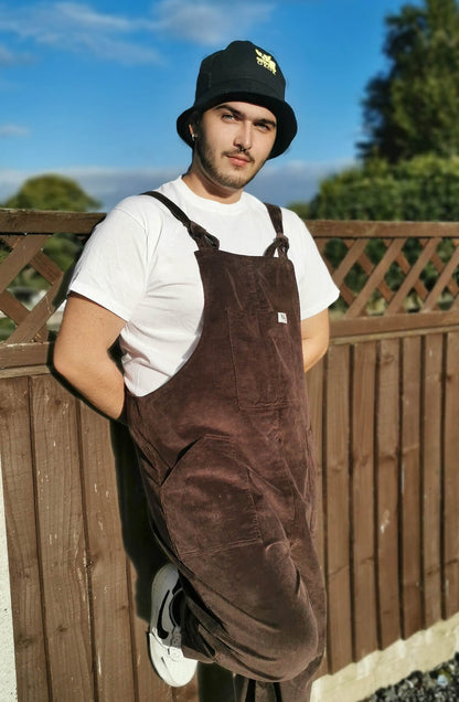 male model wearing YAYS dugnarees in Umber Brown, side view